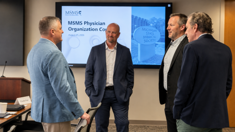 4 men standing in front of MSMS sign